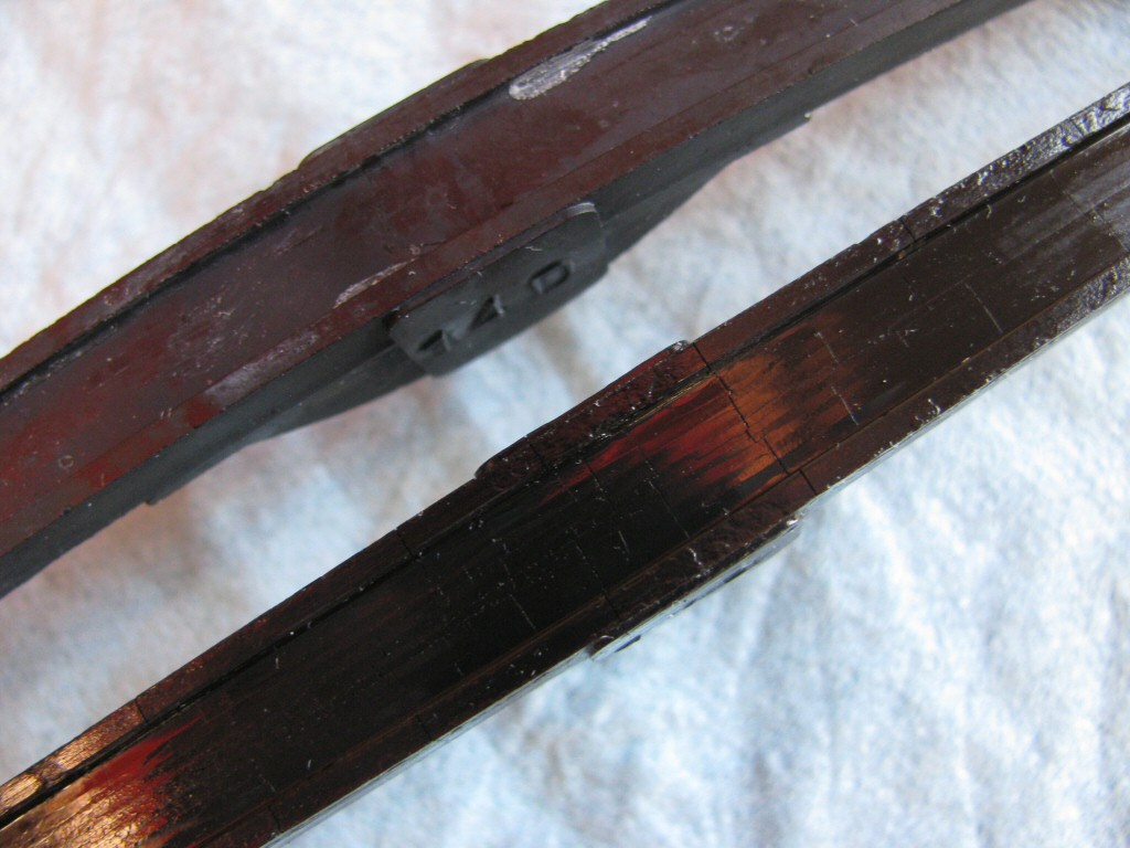 Rear cam chain guide. New on top, old on bottom. Close up of the track.