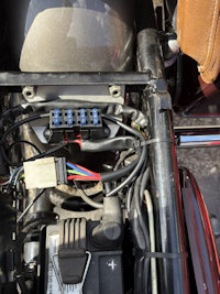 John created this separate bracket for mounting the fuse block on his Moto Guzzi California III.