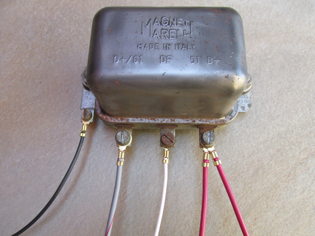 Original Magneti Marelli mechanical voltage regulator.