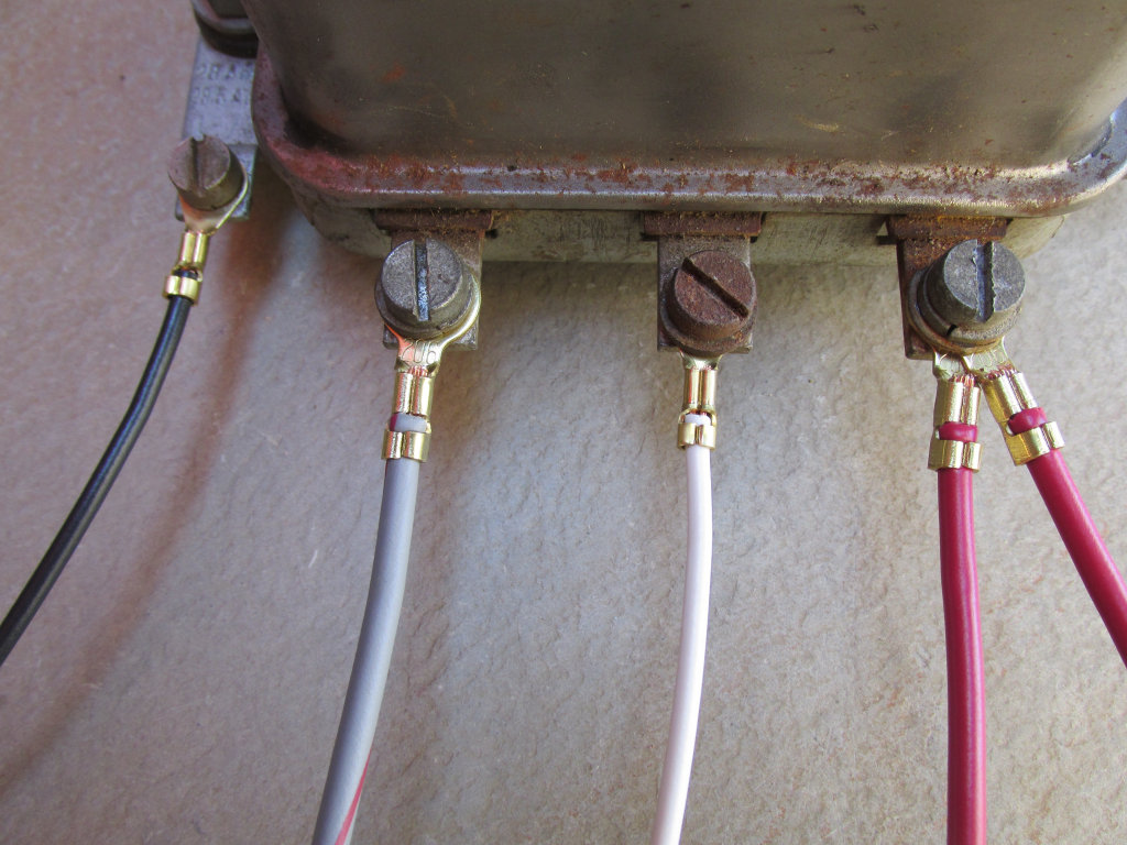 Original Magneti Marelli mechanical voltage regulator.